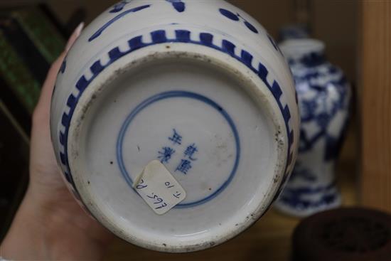 A 19th century Chinese blue and white ovoid jar, wood cover and two similar smaller vases tallest 15cm